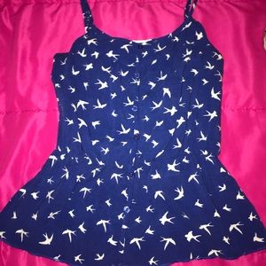 Blue spaghetti strap shirt with button accents